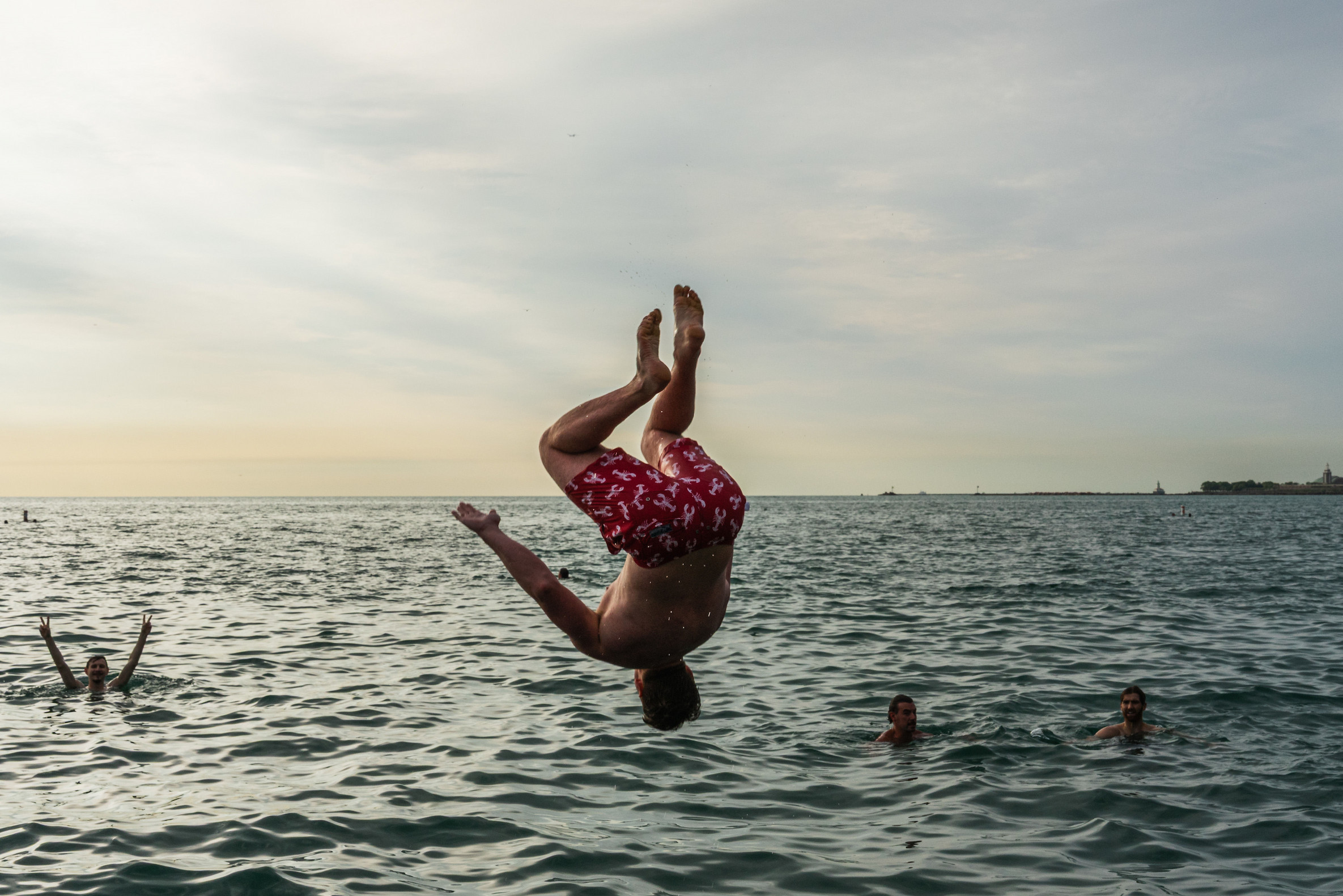 Participant jumps into Lake Michigan for Frosty Fridays near the Lincoln Park Chess Pavilion on June 24, 2026.