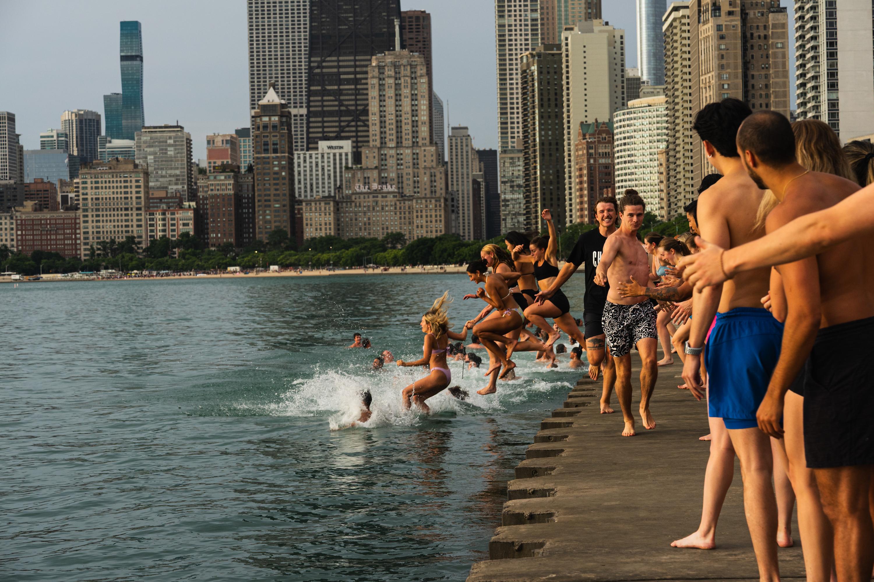 Jacob White, the organizer of Frosty Fridays, Friday morning, ran down the concrete beach, high-fiving people as they jumped in behind him. June 24, 2026