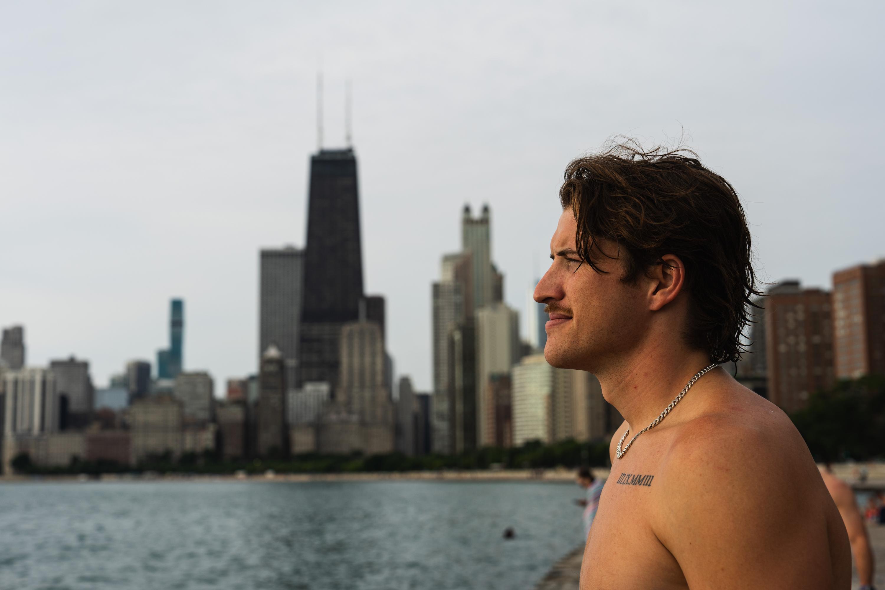 Jacob White poses for a portrait. He started to post on social media about his Friday morning jumps into the lake shortly after moving to Chicago, attracting around a hundred people to join him. One reason he started was as a way to meet people. 'Moving to a big city is challenging to go out and meet new friends. So I was like, [Frosty Fridays] is a good way to, you know, connect with people.' June 24, 2026