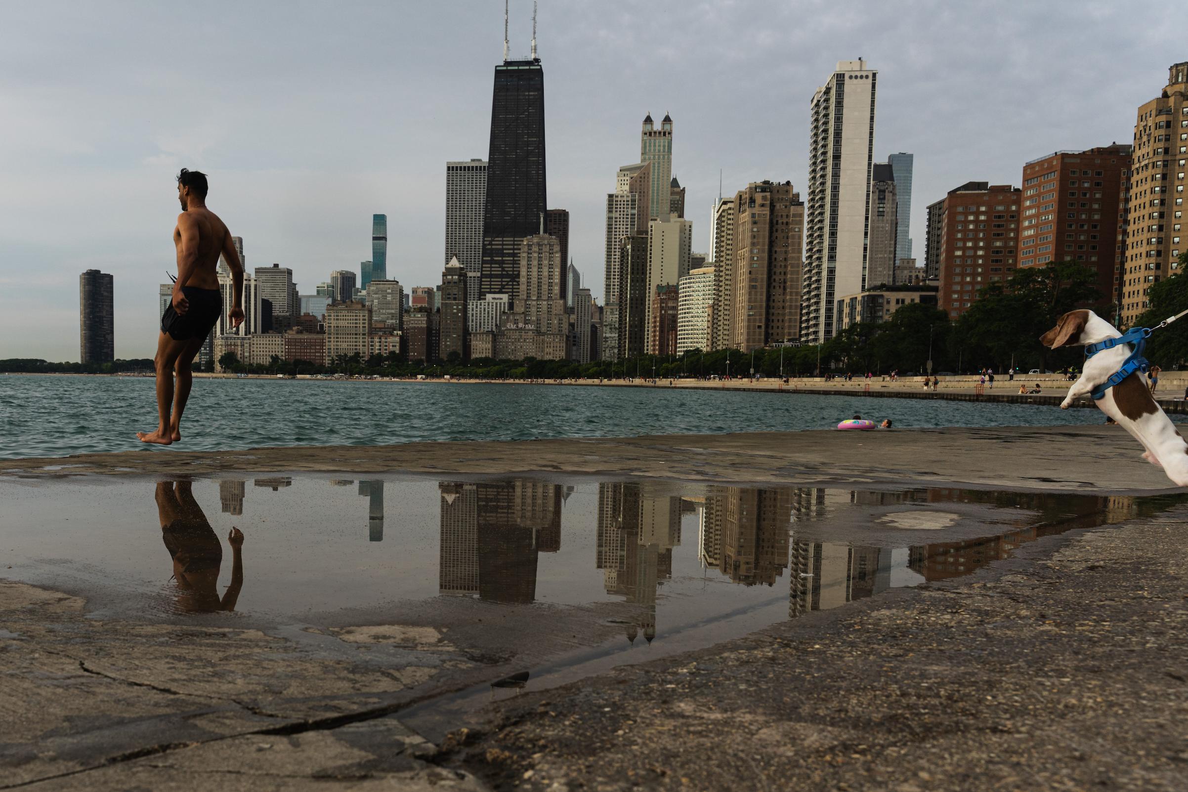 Participant jumps into Lake Michigan for Frosty Fridays near the Lincoln Park Chess Pavilion on June 24, 2026.